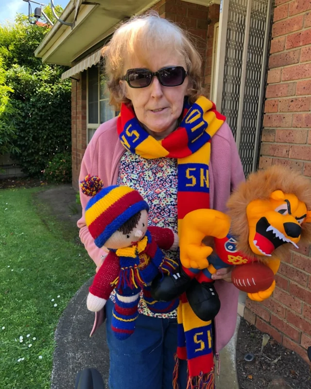 Susan getting ready to watch her AFL team win the grand final, Go the lions 🦁